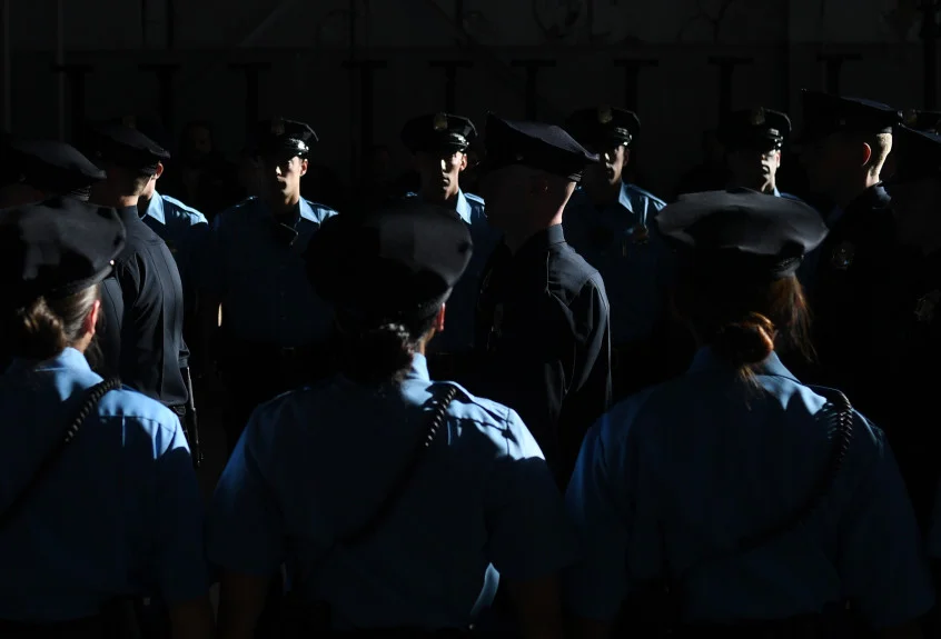 Police recruits walk in for their graduation at Denver Police Academy training facility, Jan. 6, 2017. RJ Sangosti, The Denver Pos