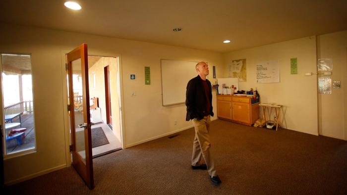 The Rev. Tim Kutzmark of the Unitarian Universalist Church of Fresno walks through a room at the church that will be offered as sanctuary to an undocumented individual or family if members approve. (Genaro Molina / Los Angeles Times) (Genaro Molina / Los Angeles Times)