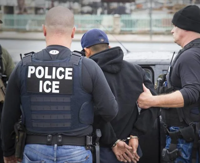 Immigration and Customs Enforcement agents make an arrest in Los Angeles in a February file photo. ICE agents detained 26 undocumented parolees reporting for community service Sunday morning at a Tarrant County facility on Cold Springs Road. Charles Reed Immigration and Customs Enforcement via AP