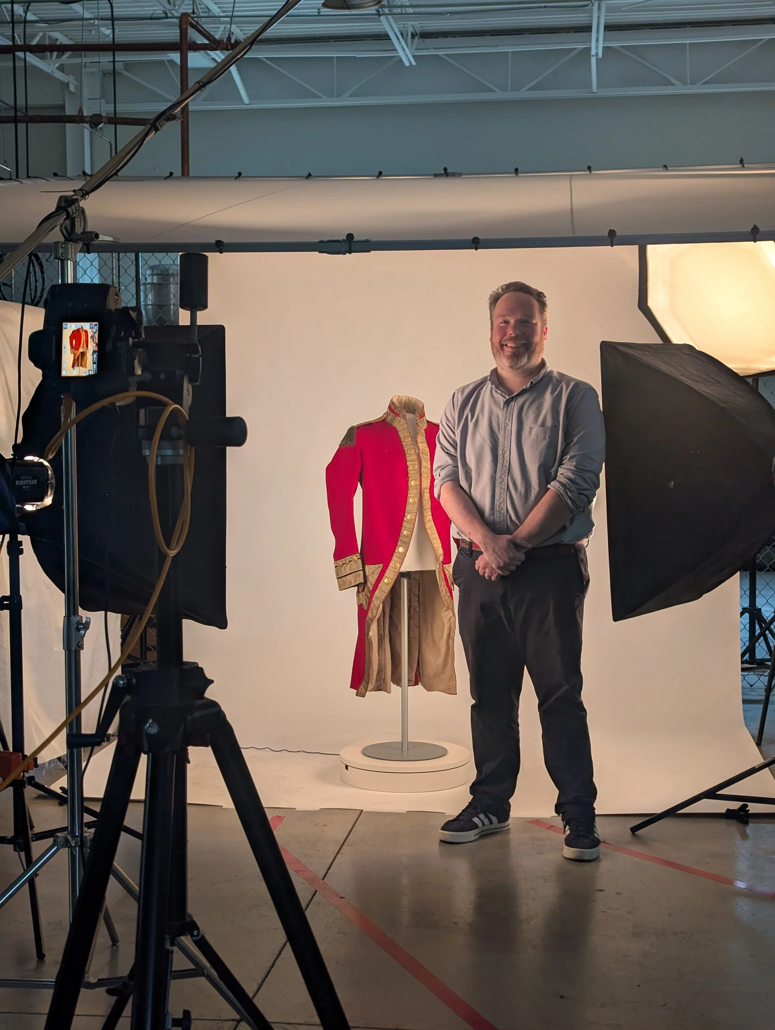 John Kepchar of Kepchar, LLC beside the British Red Coat on set at the Manufacturing Solutions Center studio in Conover, NC