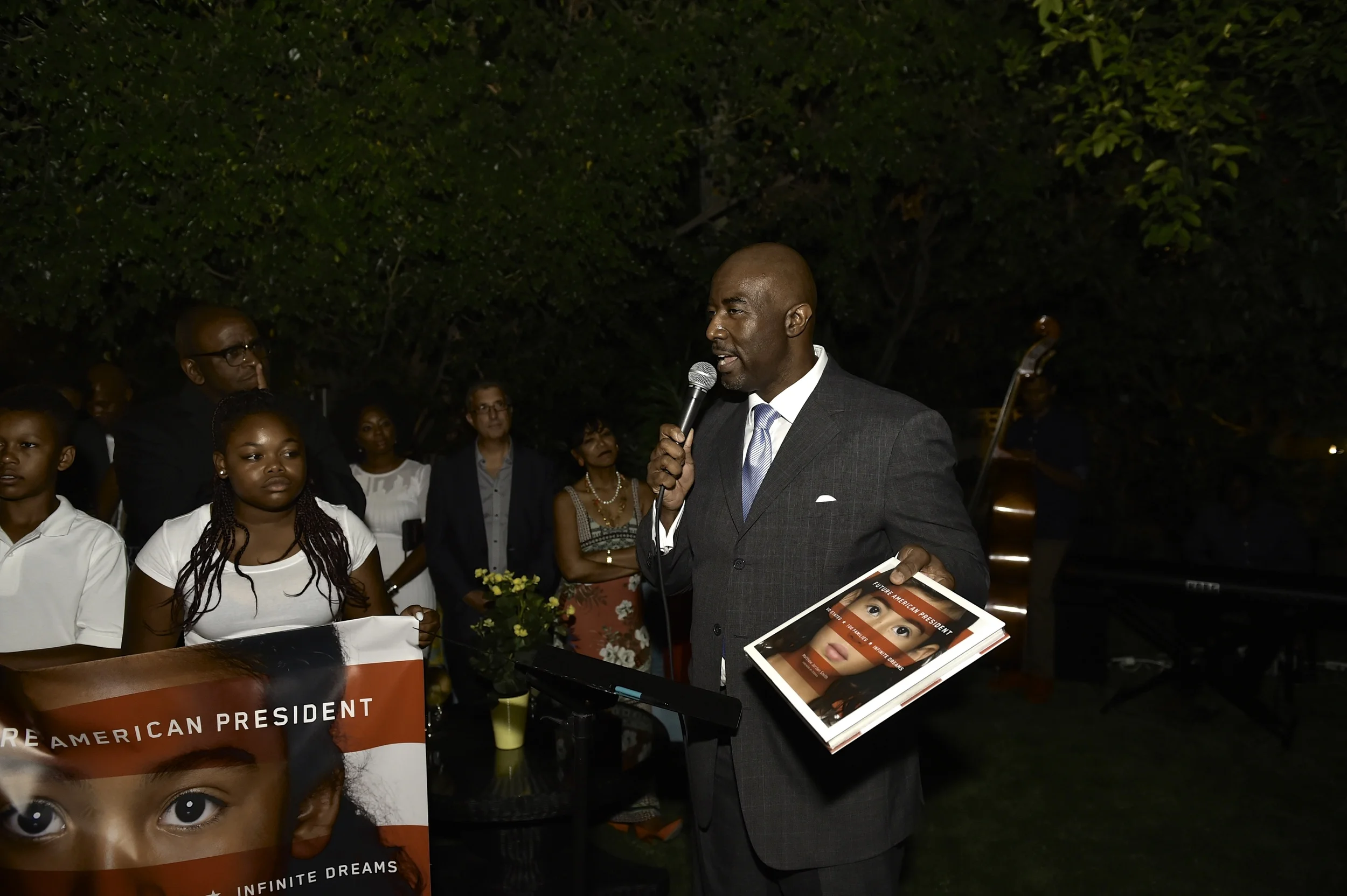 Caption: Photographer Matthew Jordan Smith speaking at the launch party.