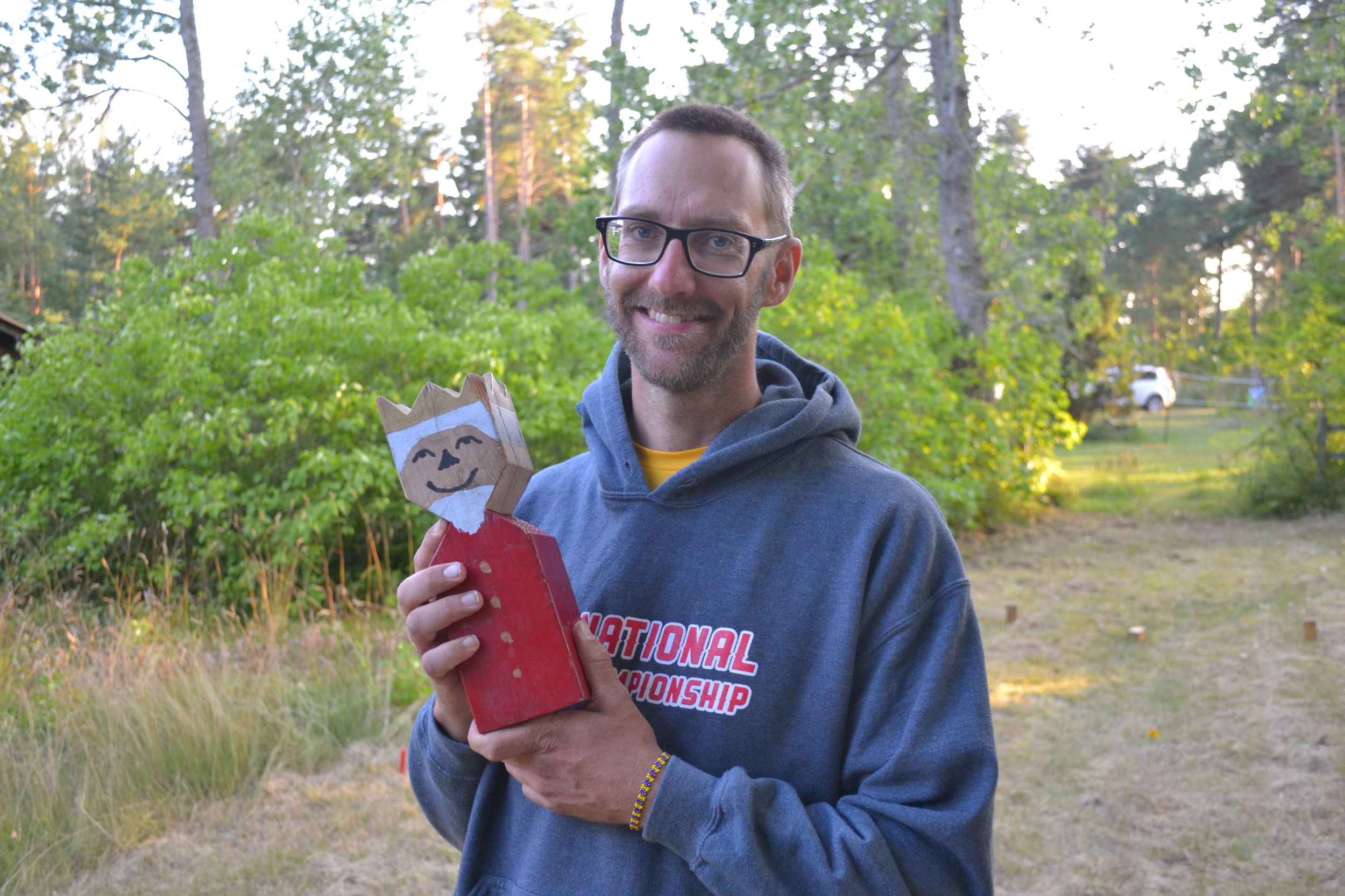 Kubb Farmer - Aaron Ellringer - Holding what is thought to be the first King of the modern Kubb Revolution in Gotland, Sweden.