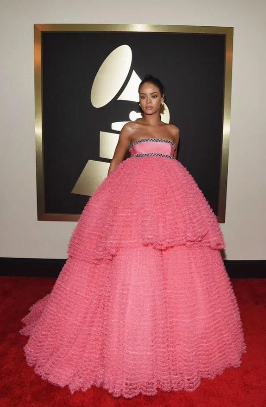 Rihanna was pretty in pink, perhaps a bit too much emphasis on pretty and sweet, as the look reminds us of a Quinceñeara dress. The makeup artist delivered elegance, but the tulle overload on the dress left too much to be desired.*Lola's Notes:* FLA…