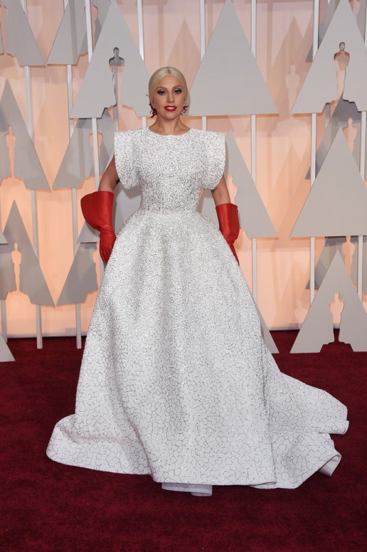 The most confusing look of the night, perhaps, came from Lady Gaga. This look would not have come as such a shock if Gaga hadn’t just cleaned up her fashion act, stepping up her game of glamour in recent months, after the release of a joint jazz album with Tony Bennet. Gaga shocked the red carpet, as well as viewers, with red gloves and a marbled gown from Alaia.