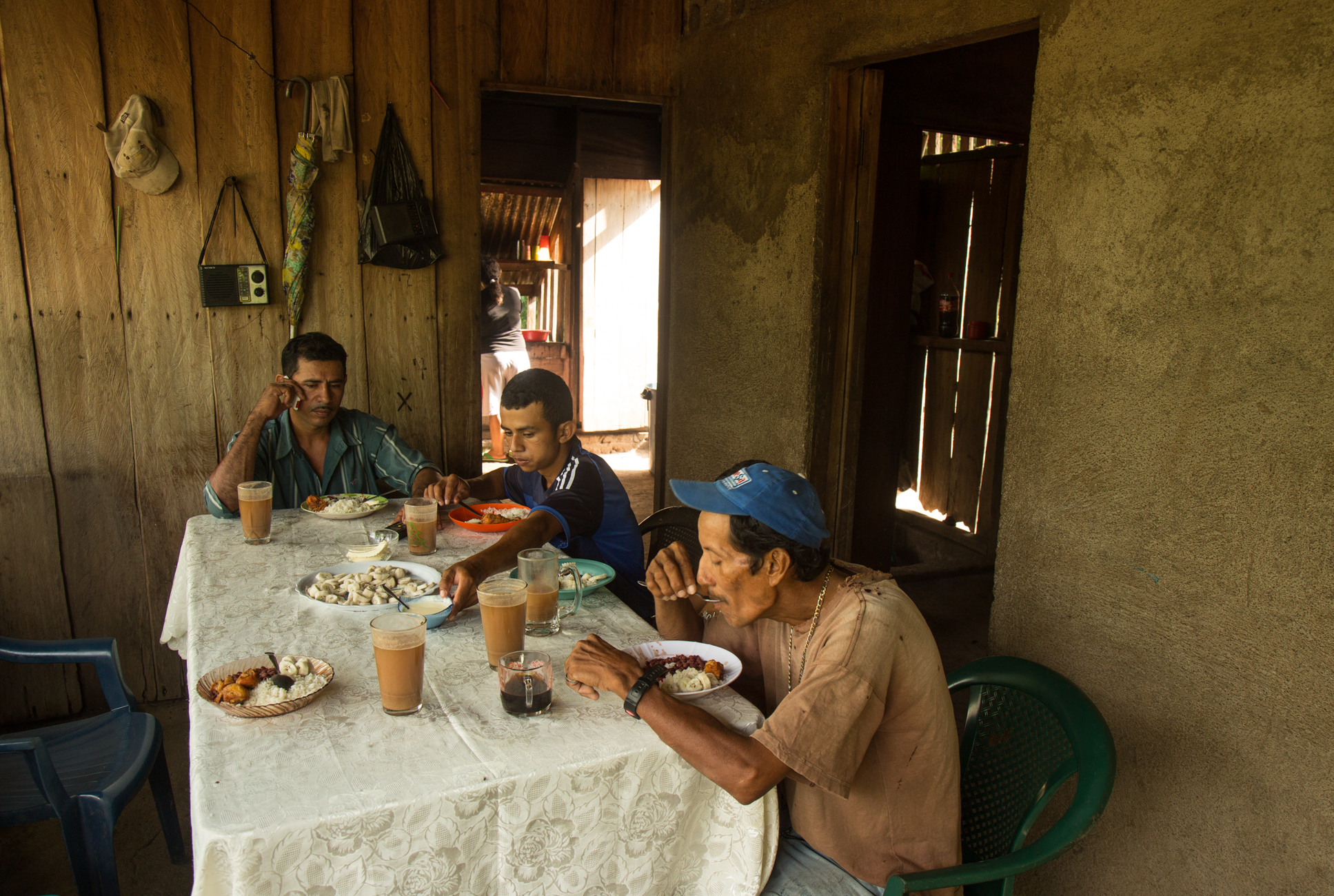  Javier Carmona eats breakfast with his sons Elder and Marcos the morning of a protest in nearby El Tule against the Nicaraguan Canal project and the Ley 840. Javier, a community leader and organizer with the Consejo Nacional which is fighting agains