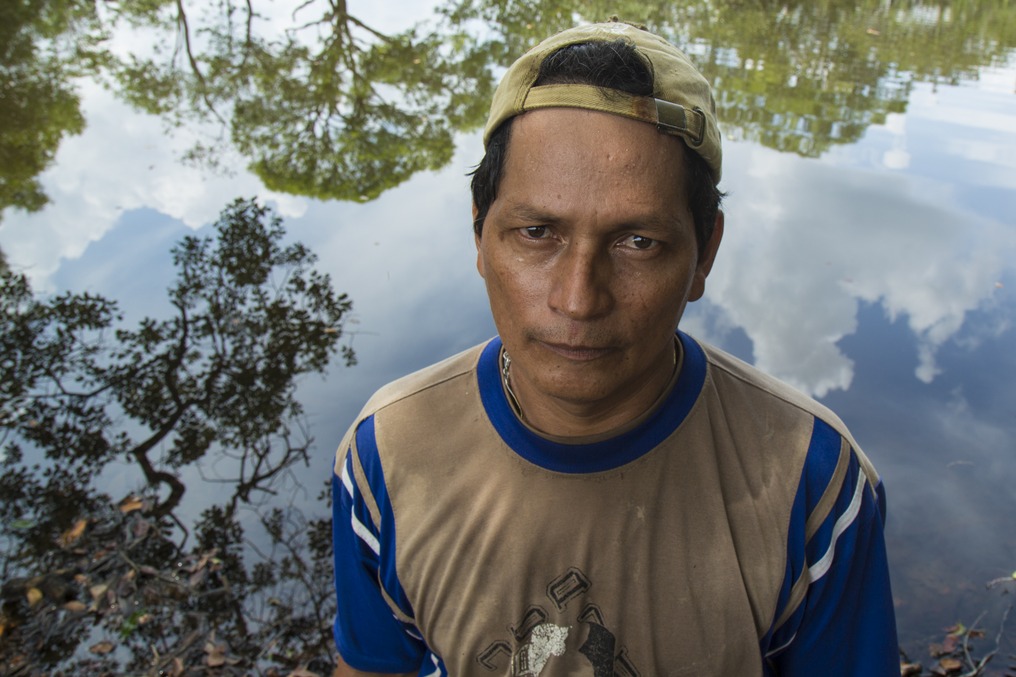  Azdrubal Linares Vaca, a local farmer, facing the only freshwater lagoon on his property he says that has not been contaminated by oil. An oil spill in the Caño Rubiales in 2013 contaminated 5 of its 6 lagoons and killed all his animals, also pollut