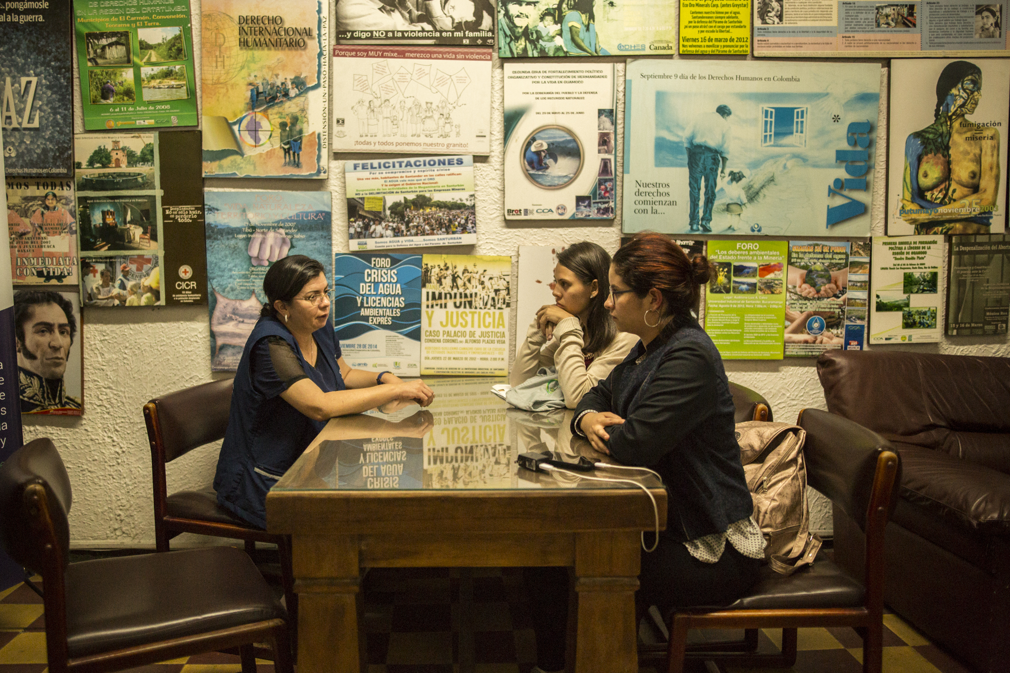  Julia Figueroa, human rights lawyer and leader of the CCALP, all women's legal collective, meets with two young lawyers from the region who she is recruiting into her cooperative in the office during the evening in Bucaramanga, Colombia. May 9, 2017