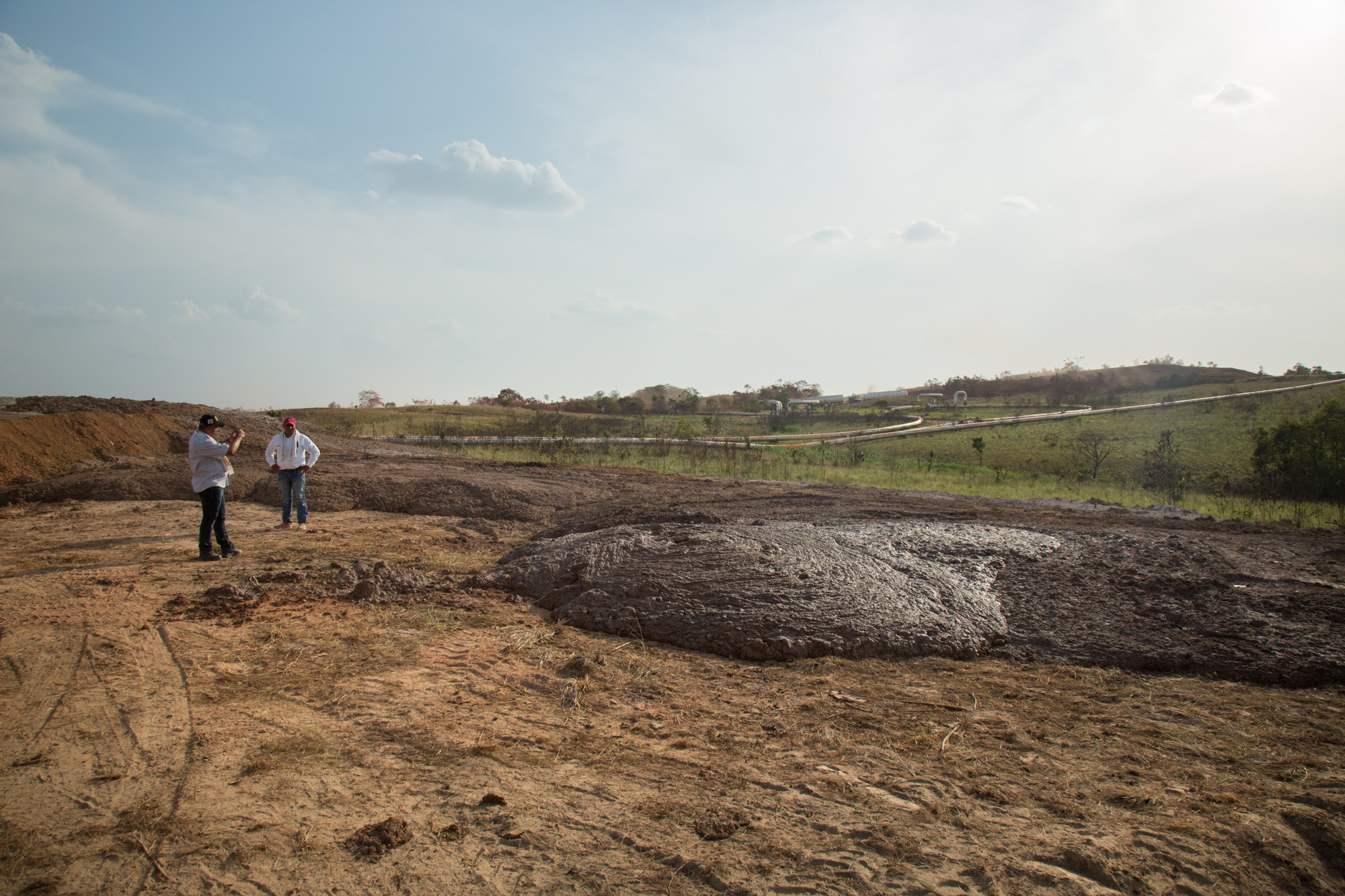  Hector Sanchez photographs oil contaminated mud that was recently dumped illegally by a dump truck. When it rains, the mud will end up flowing into the local rivers. Rubiales, Meta, Colombia. April 9, 2017 