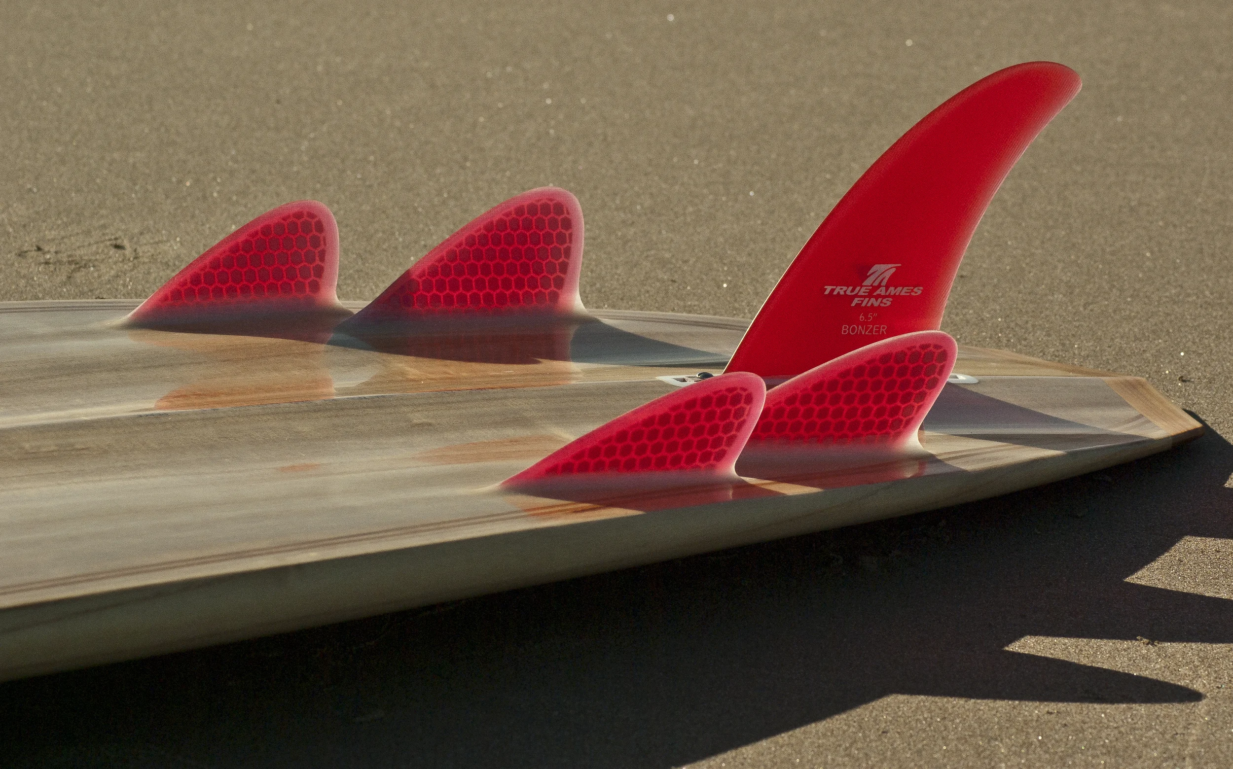 Red Fins on a Bonzer Hollow Wooden Surfboard