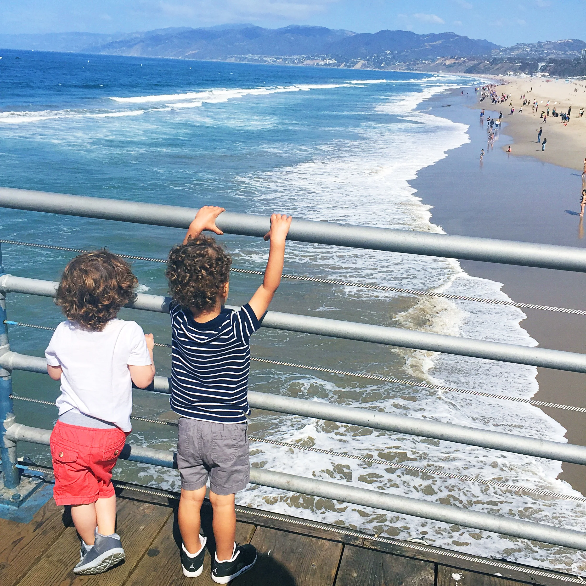 Last time we came to the pier, my son was afraid of the waves. This time he was showing them off (mine's the one in stripes.)