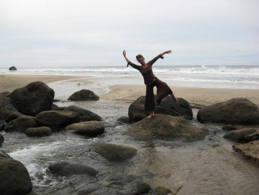 Deb dancing on the beach