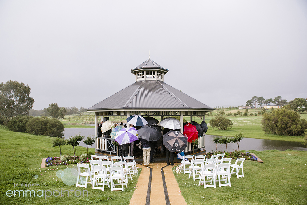 Guests making good use of umbrellas and the pavilion at Sittella Winery