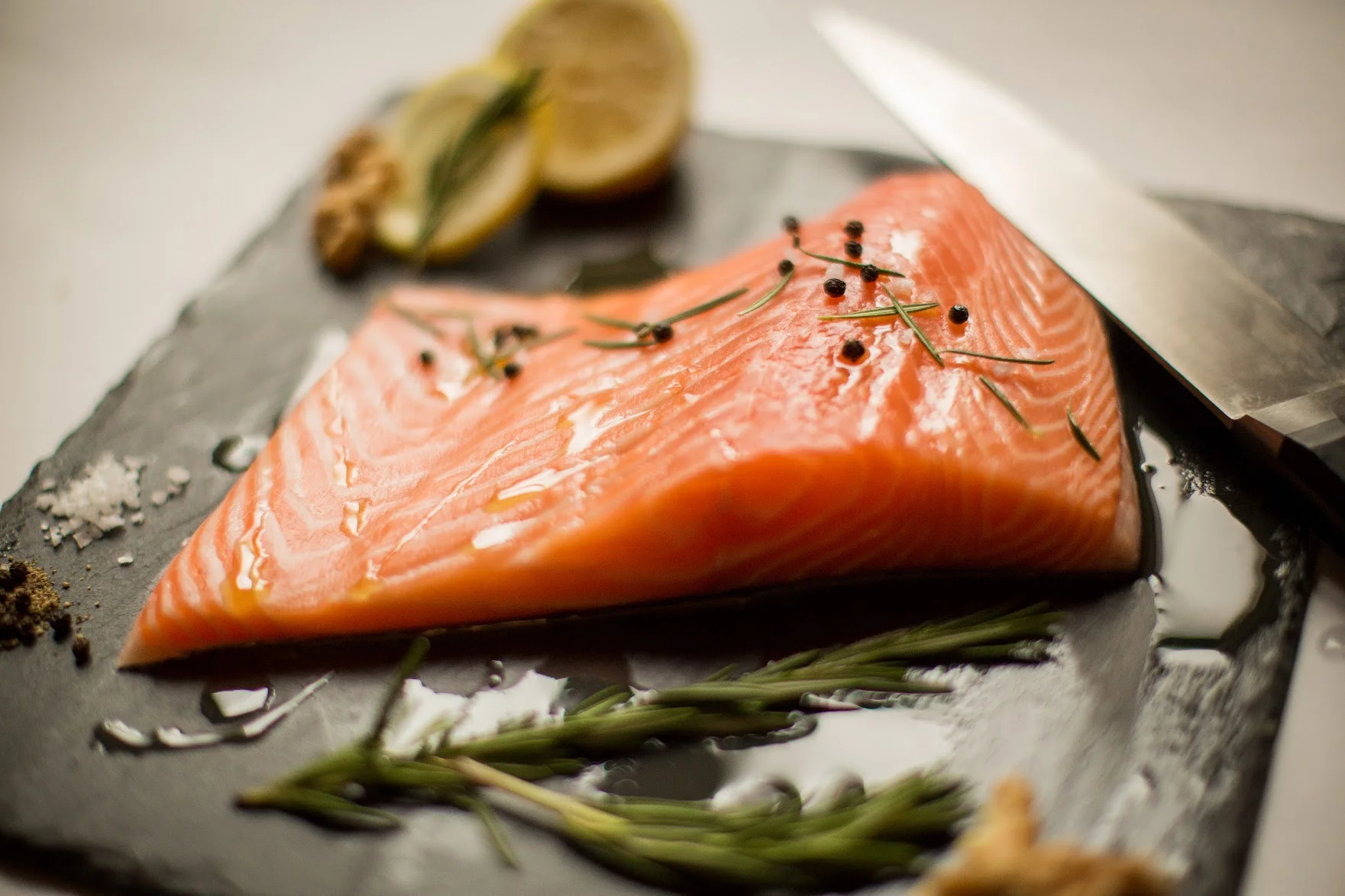 One quarter of all adults living in NYC and half of Asian New Yorkers have blood mercury levels equal to or higher than the level that is considered to be safe.1 Sounds scary, but what does it mean? Methylmercury (MeHg) is a toxic substance that humans mainly intake from eating contaminated fish. MeHg levels tend to be increased in fish that are higher on the food chain (e.g. swordfish), as they consume lots of smaller fish (i.e. plankton) that have mercury in them and therefore accumulate more MeHg than a smaller, younger fish would. It’s important to be cautious and choose those fish that have lower MeHg levels to avoid the host of problems that excess mercury can cause. Symptoms of mercury poisoning include muscle weakness; mental changes (e.g. memory loss); impairments in coordinated movements like walking; and skin rashes. Some even suggest that consistently low levels of methylmercury can increase the risk for heart disease. Pregnant women are particularly advised against consuming fish with high MeHg levels because excess mercury has been shown to cause irreversible damage to the fetus’s central nervous system, leading to cerebral palsy, blindness, deafness, seizure disorders, and intellectual disabilities. One of the big issues with answering the question of which fish is best to choose is that one type of seafood can be raised in different ways; the way the fish is raised will impact their mercury content and nutritional value. For instance, one review found that mercury concentrations of wild-raised seafood was higher than the farmed version; however, this has relationship has not always been shown, as some studies find that there is no significant difference in mercury levels of farmed versus wild salmon as well as farmed versus wild cod. The idea of some fish being potentially harmful to you is a difficult concept because we are repeatedly told that fish is one of the best foods to eat, and we should be substituting it as the protein in our meal in place of other animal-based proteins. Fish such as albacore tuna, salmon, sardines and halibut are good sources of omega-3 fats, consumption of which have been shown to be protective against heart disease and are considered anti-inflammatory. Although consumed less frequently (most frequently in sardines), the bones of fish are a great source of non-dairy calcium. But now we know that certain fish can contain high levels of this toxic substance, mercury, which is not so good for our health. So what do we do? Limit intake of high mercury fish such as shark, swordfish, king mackerel, bigeye and ahi tuna, and tilefish to a few times yearly; if you’re pregnant, nursing or plan to become pregnant, avoid these all together. Instead, choose seafood that is lower in mercury including shrimp, oysters, canned light tuna, sardines, and wild salmon; aim for 2-3 4oz portions of these type of fish weekly. Because albacore (“white”) tuna has more mercury than canned light tuna, choose the latter as often you can. You can get your mercury levels tested with your MD, particularly before starting a family. This is a good resource to check the mercury content of your fish: http://www.fda.gov/Food/FoodborneIllnessContaminants/Metals/ucm115644.htm And this great to keep in your wallet and help you choose lower mercury fish more frequently: https://www.nrdc.org/sites/default/files/walletcard.pdf 1. Department of Health and Mental Hygiene