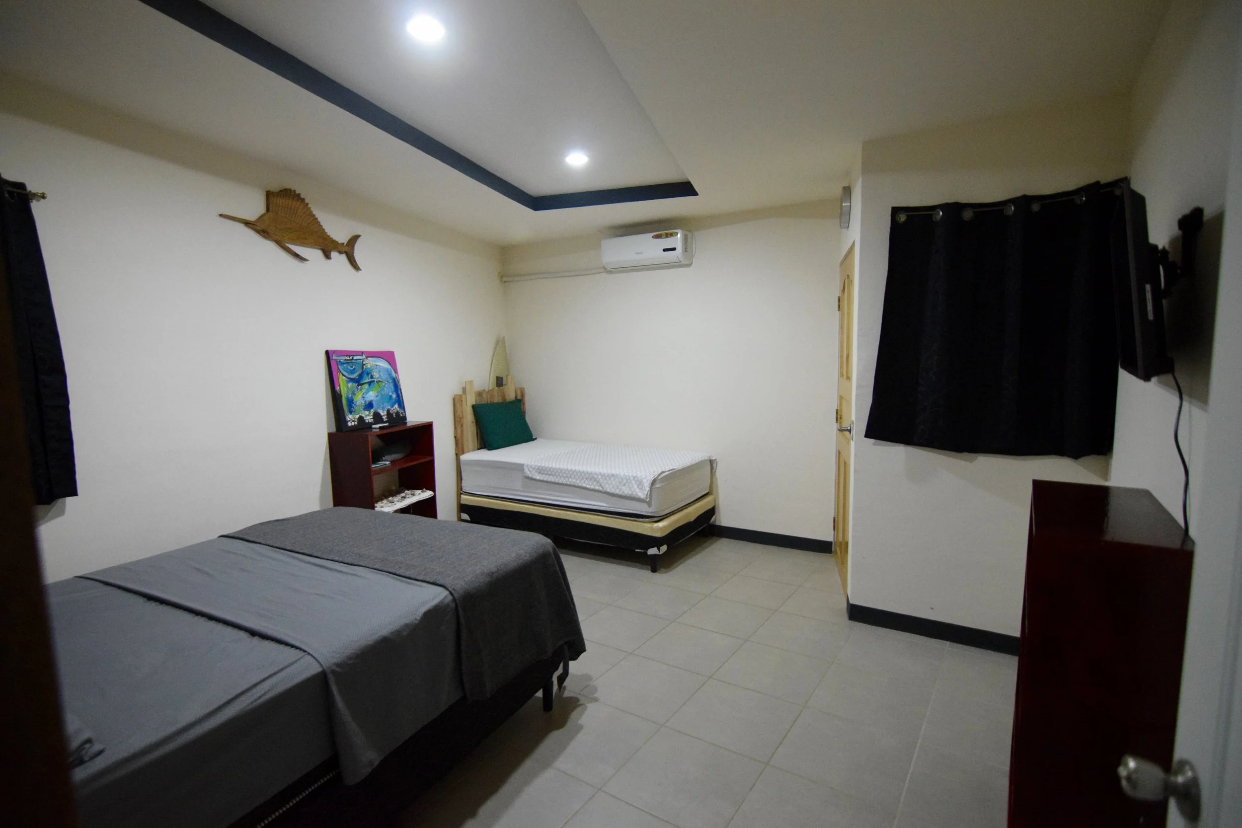 our large size rooms- EQUIPPED with queen and a single bed. 
