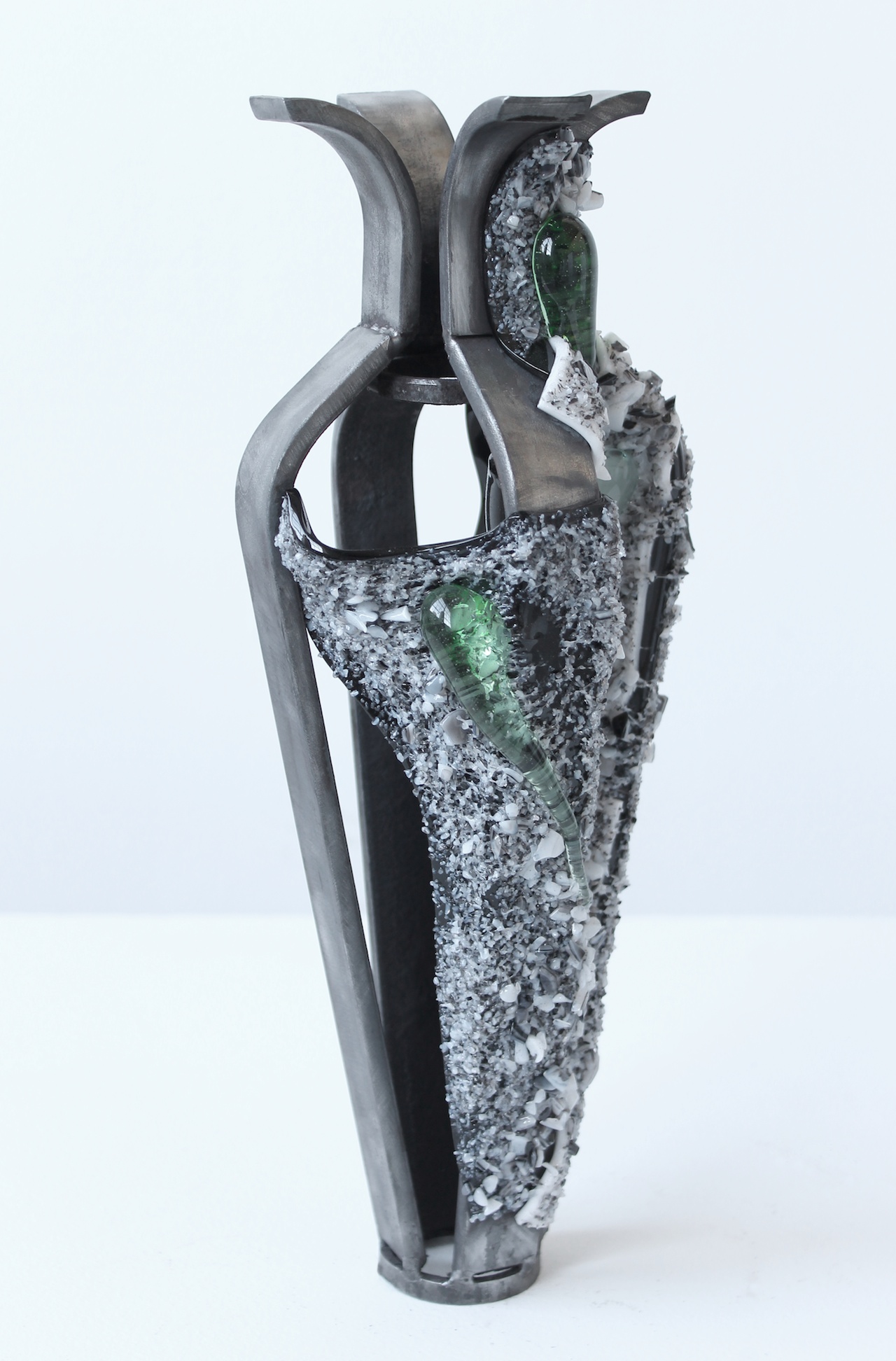 2015, "Ice Jacket" series. Kiln glass over steel armatures. "Ice Jackets" look at the reflective qualities of the glass, as well as referencing artifacts found along the banks of the Penobscot river after recent dam removals. The