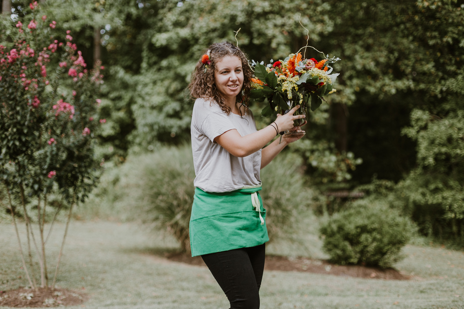 Brittney from Local Color Flowers setting up before the ceremony