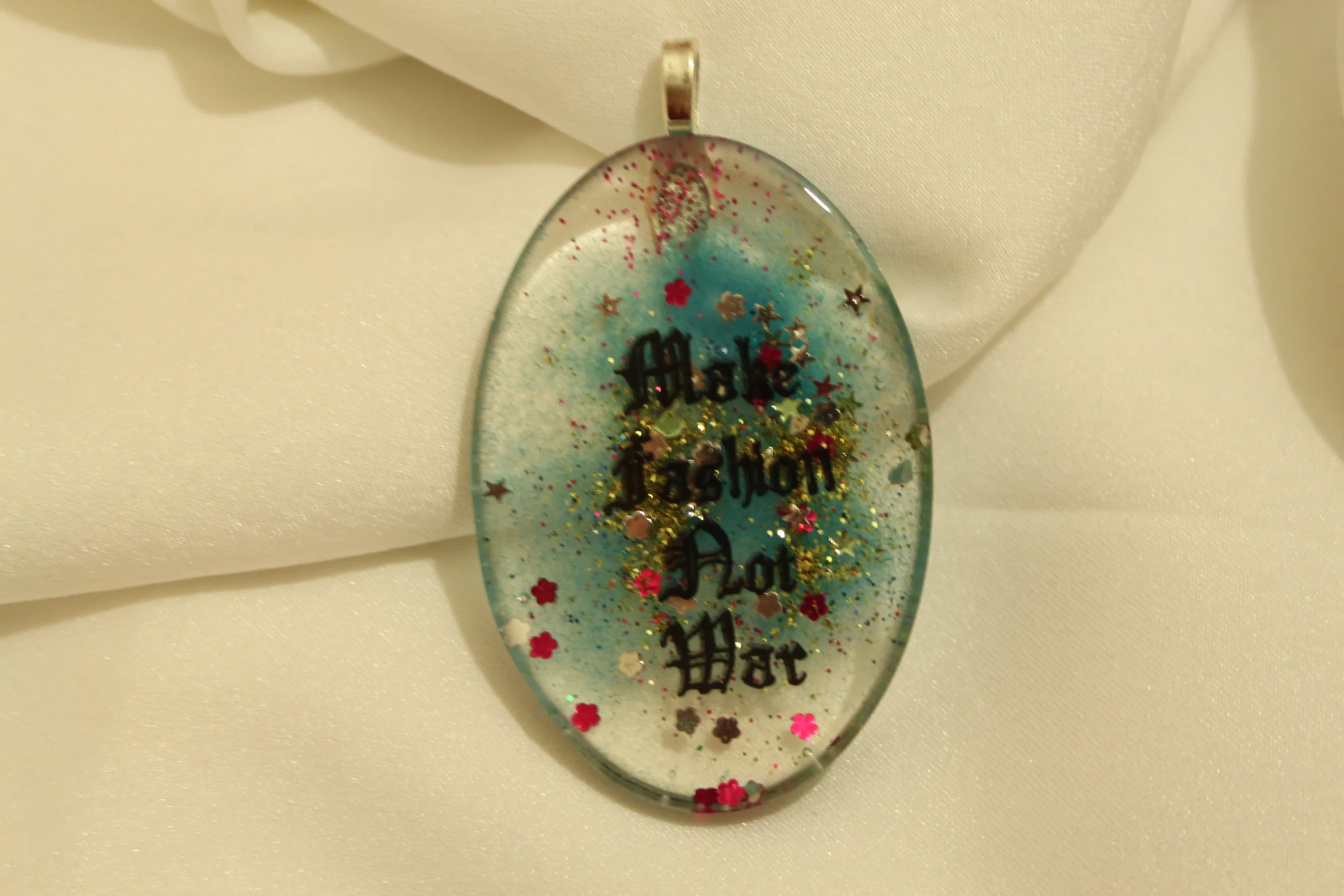 Make Fashion Not War Blue Glitter Pendant