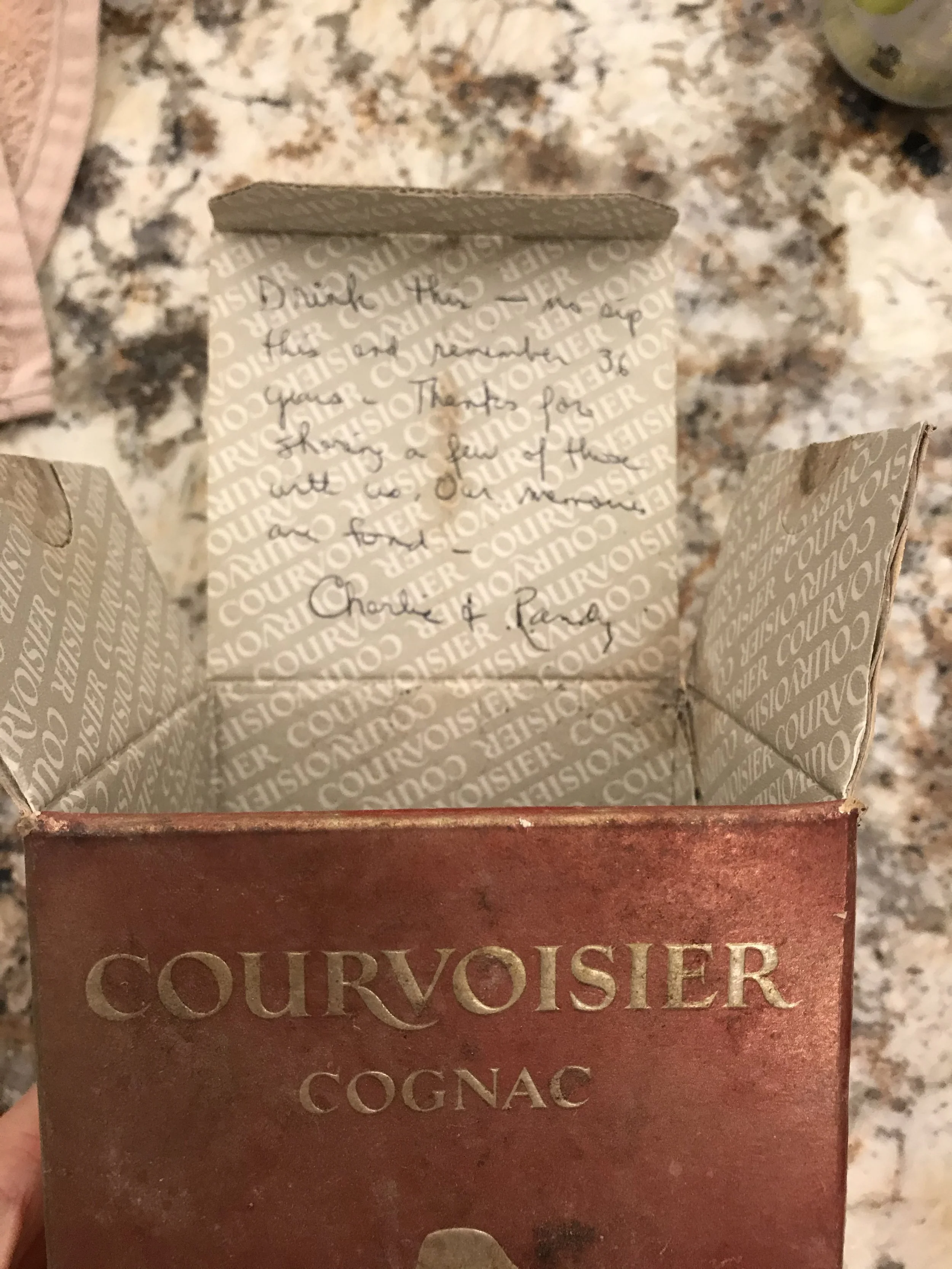 Courvoisier box with inscription reading, Drink this-no sip this and remember 36 years - Thanks for sharing a few of these with us. Our memories are fond - Charlie and Randy