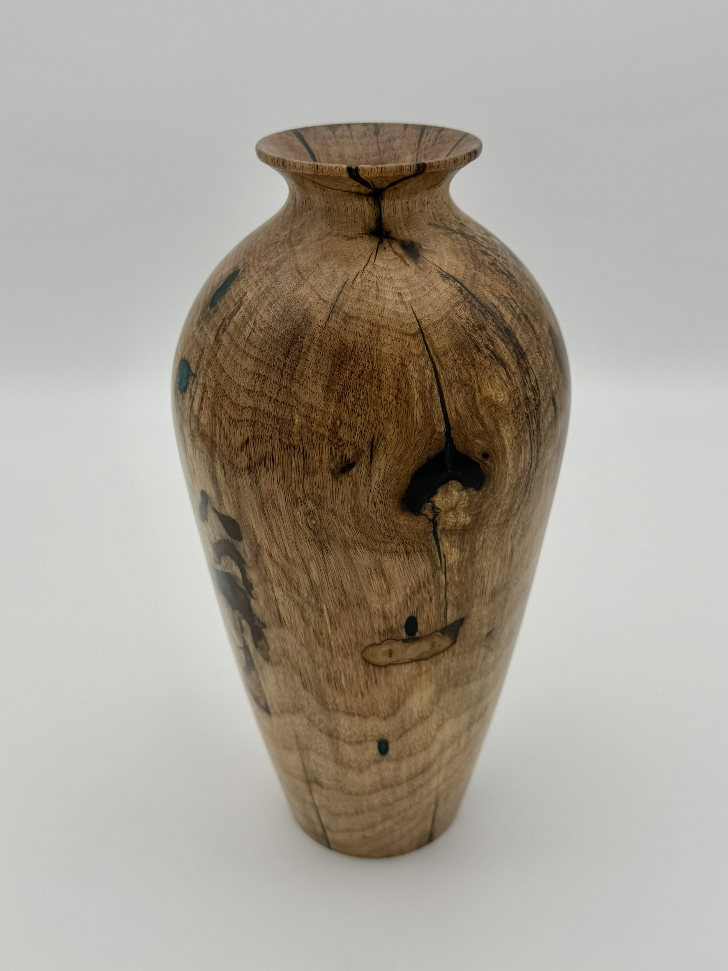 Finished nine-inch persimmon hollow form with a flared rim and dark resin-filled cracks, photographed against a white background.