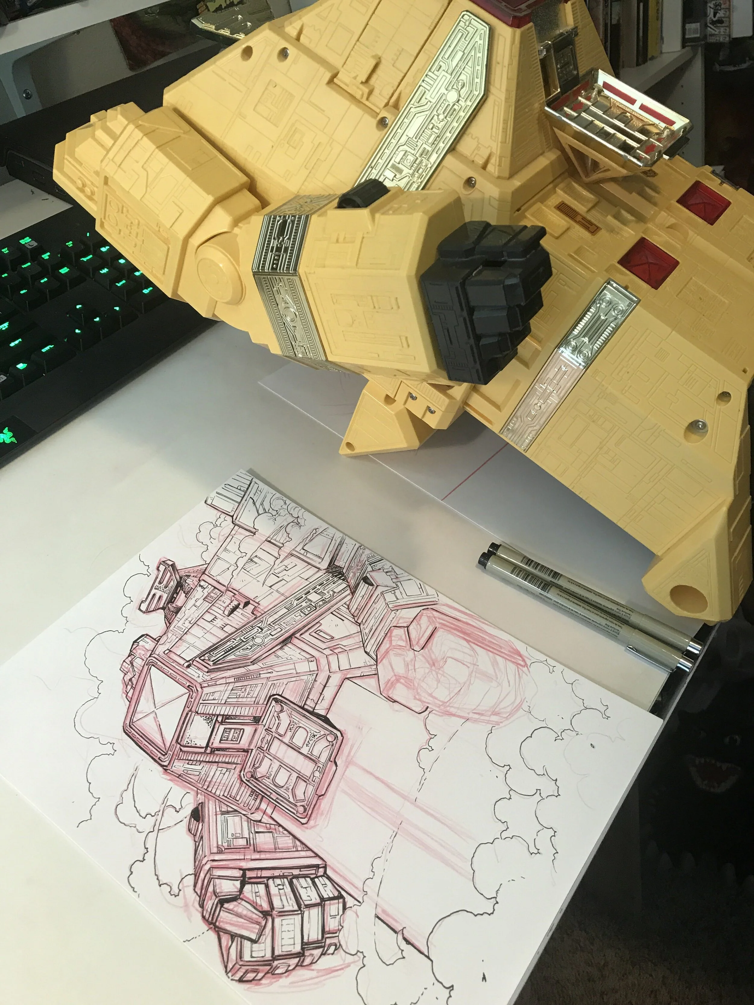 Matt using Pyramidas toy for reference as he sketches.