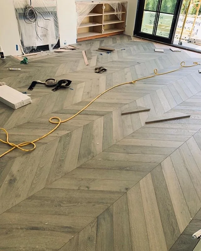 A beautiful installation for a master suite! #chevronfloor #oakplankfloor #interiordesign #customwoodfloor #ljbhomedesign #belairhome