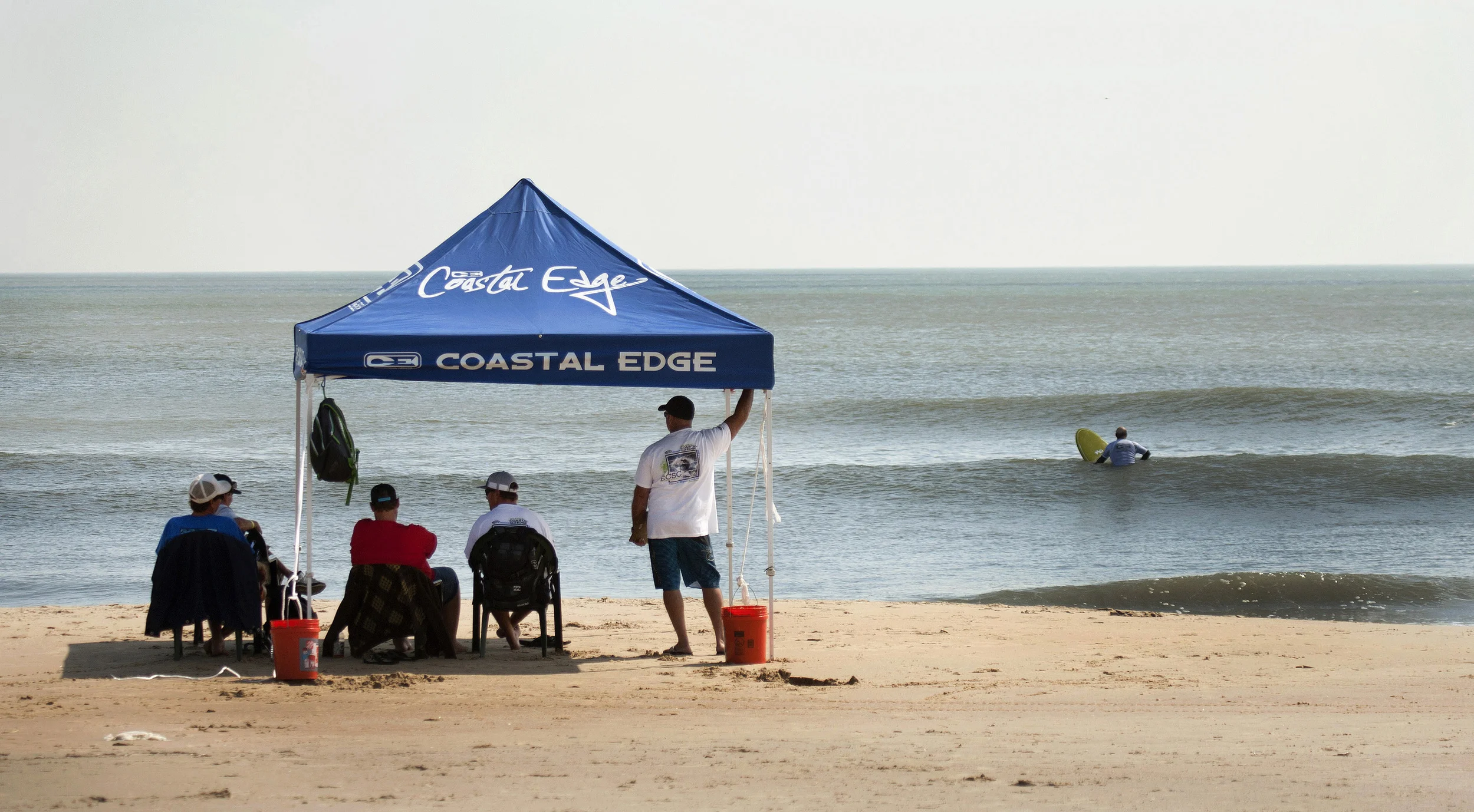 2011 The contest most go on , morning after Hurricane Irene made it's way over Virginia, the East Coast Surfing Championship officials setup to finish the Coastal Edge 49th Annual East Coast Surfing Championships. Judge's setup in chairs on 1st street beach in Virginia Beach, Virginia like the old days before the elaborate scaffolding.