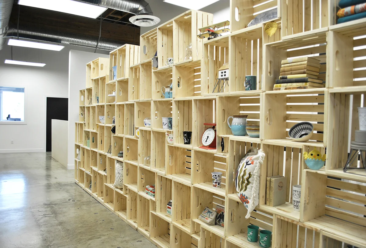  The Client’s had a tight budget and timeline, and RAW was up for the challenge! RAW was able to find creative and inexpensive design solutions to display Danica’s beautifully designed products that also acted as feature walls to divide the open offi
