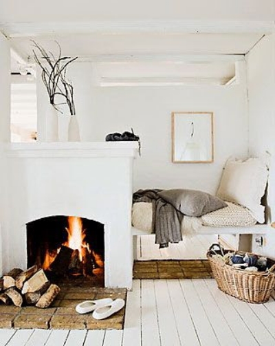 (10) Sleep like a Log - Use a D.I.Y. fireplace to divide your small space. Image via A Simple Life Afloat . 