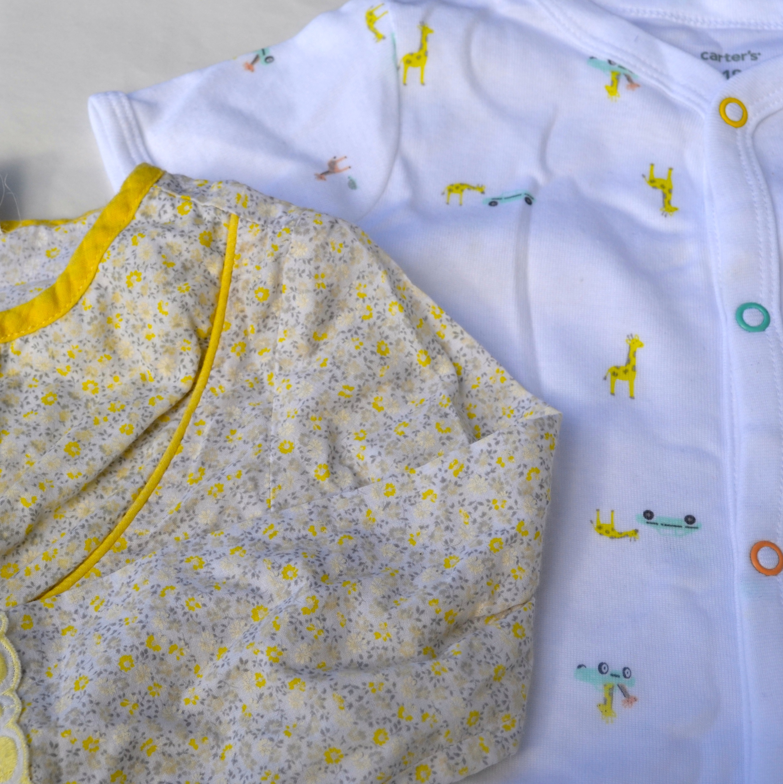 Petals and Pastels! A necessity for every toddler girl's spring wardrobe. Yellow floral blouse, "vintage" Charabia from Lulu's Then and Now . Similar option here . Carter's Giraffe Creeper found at Marshall's. 