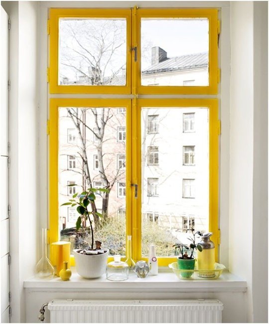 Paint your window trim yellow. Image via Apartment Therapy