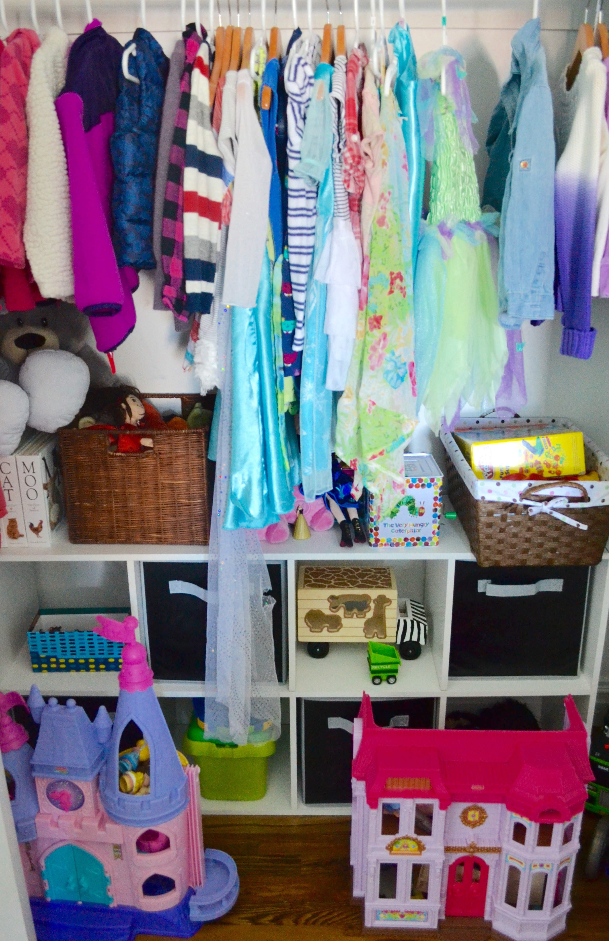 Open shelving with Erasable Chalkboard Bins conceals toys within the closet and allow fun flexibility with bin labeling. 
