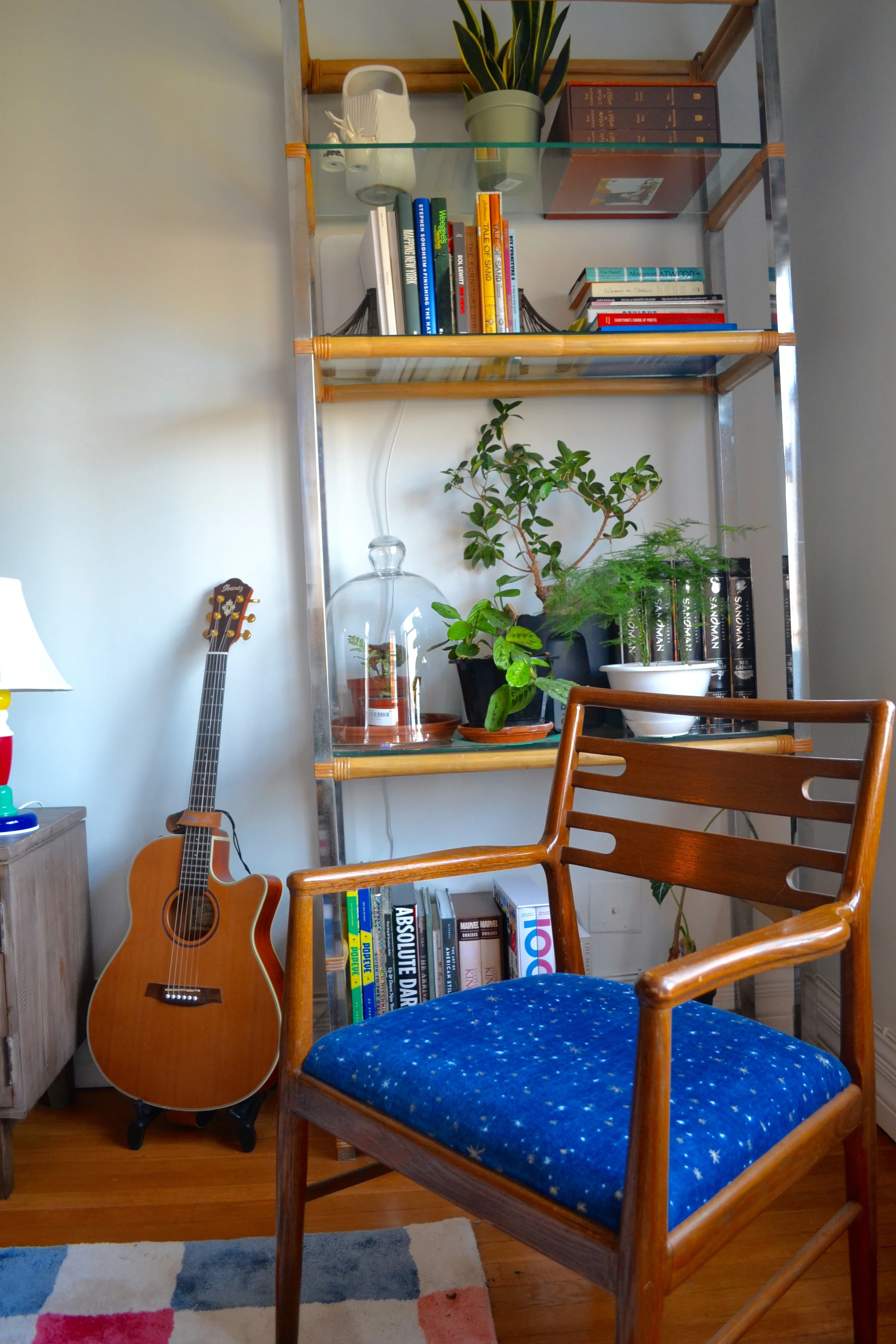 The etagere is from a thriftstore in the North Fork of Long Island, the accent chair is a Craigslist find, re-upholstered by Client Crafty with a tablecloth from Anthropologie.