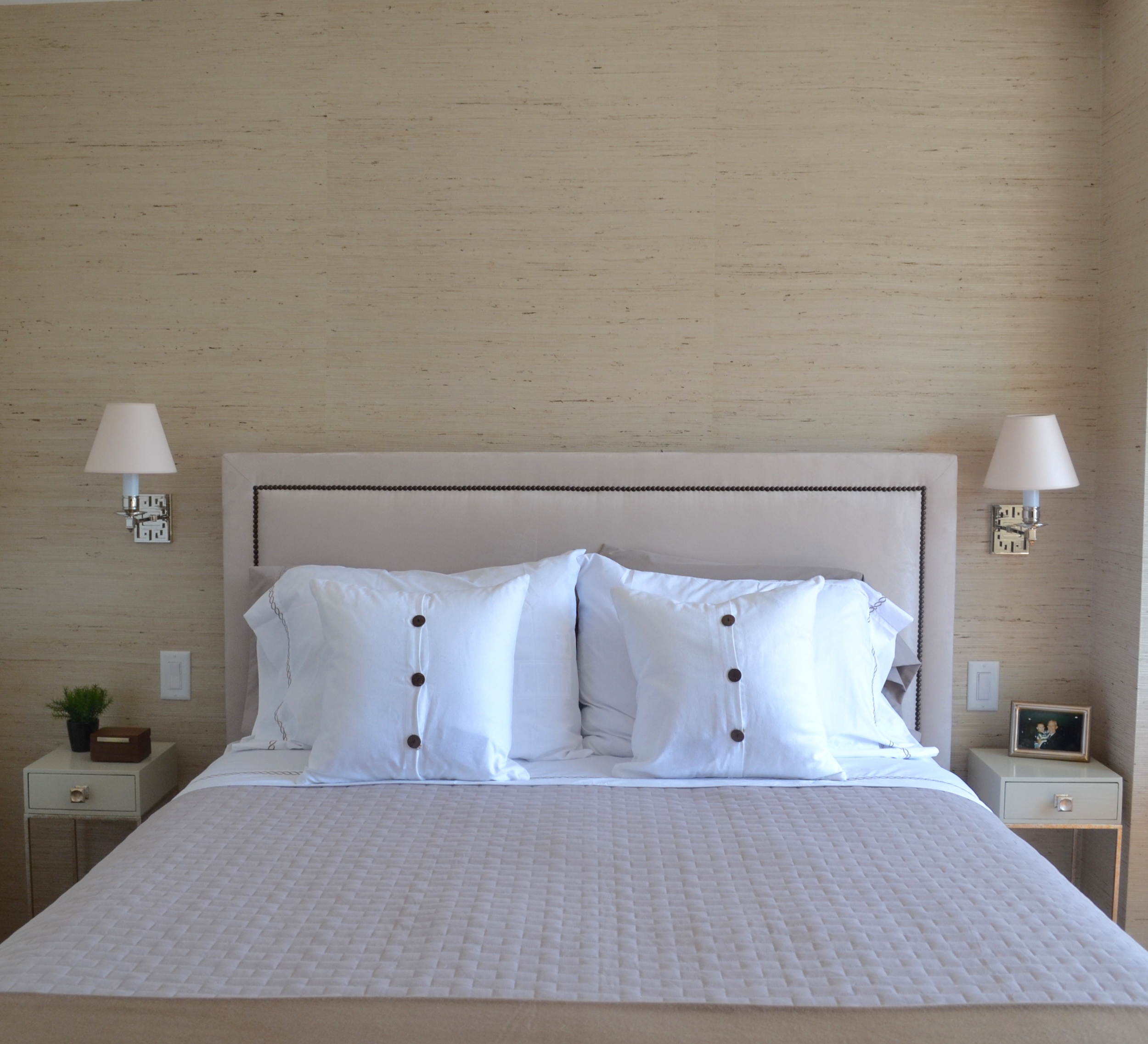 These mini accent tables were the perfect size for nightstands in the somewhat confined bed area. Just a little surface area with a drawer. The taupe lacquer and brass accents blended very well with our neutral + mixed metals scheme. The reading sconces with individual controls provide light without taking up surface space on the night stands. (And the greek key motif is a little nod to our favorite fabric in the dining area!)