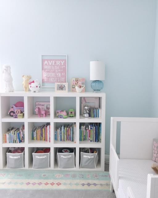 You may recognize this bookcase from the old nursery. We flipped it horizontally to provide easier access for Av to her toys and books, and now the top is more accessible for us adults. We also had the blue glass lamp from wayyy back in the day when the Brooklyn nursery was a man cave/office. #repurposing.