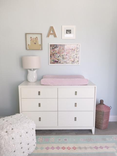 Decided to switch it up and do a gallery wall over the changing table instead of the mirror this go round. Couldn't resist the bear print from Pillowfort by Target. Also featured in this lovely gallery wall is a wooden A from Marshalls, a framed sonogram pic , and a collage handmade for Avery's by her grandmother Mimi. The hamper basket is by West Elm.