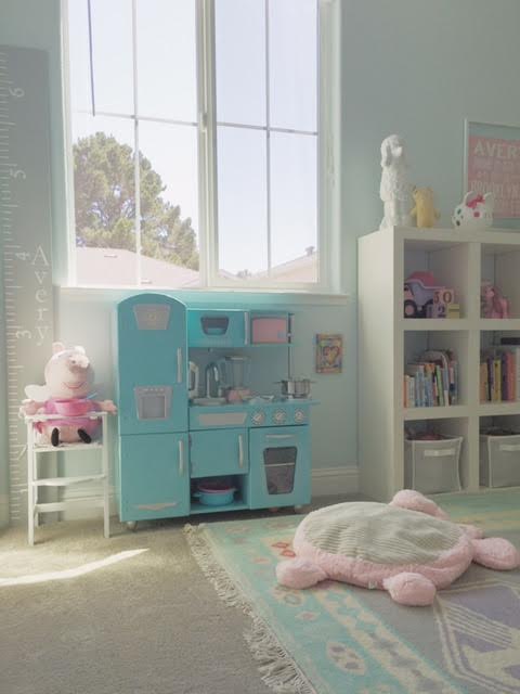 And here is that famous play kitchen. It ended up fitting perfectly under the window. Not a great pic because the sun didn't have a cloud to go behind for the shot (#caliproblems), but you get the idea. And it looks like Peppa Pig is ready for some dinner!