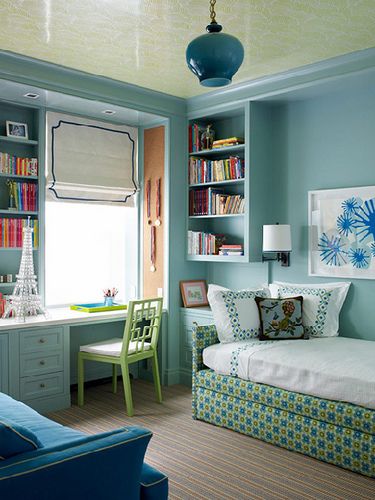 LOVE the efficiency of this girl's bedroom designed by Katie Ridder. The small space allows for a desk with library style bookshelves, a daybed with trundle AND a sofa!