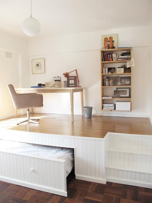 A DIY hideaway bed creates a studio space by raising the floor. Via Lucky Pony blog.