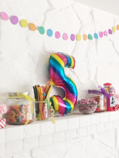 Who knew that candy made such great mantel decor! Also it was the perfect place to store this - up high where little hands couldn’t get into it until it was goody bag time!