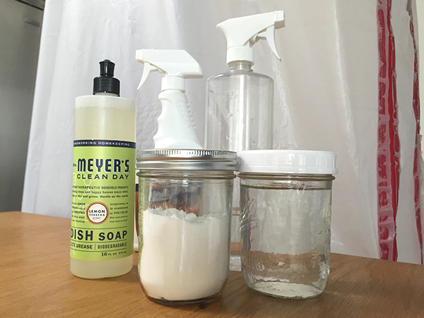 My cleaning essentials: baking soda, vinegar, dish soap, a spray bottle and floor cleaner