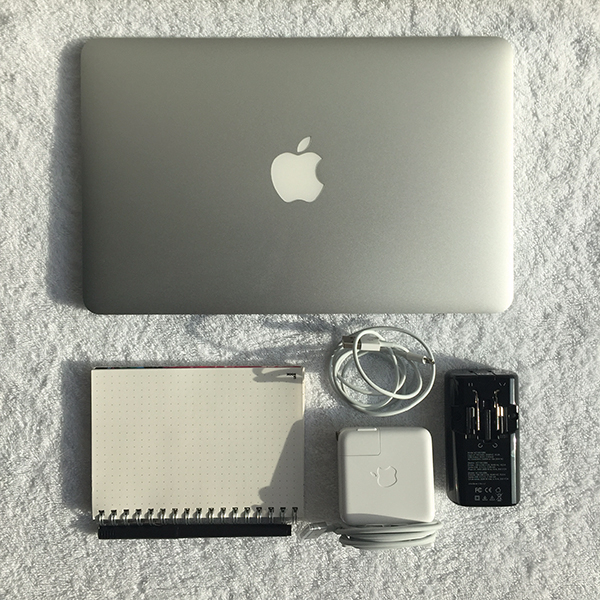For Work: laptop with charger, converter, phone charger and a notebook with pen