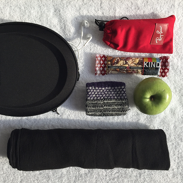 For Comfort: noise-canceling headphones, sunglasses, snacks, socks and my scarf/blanket