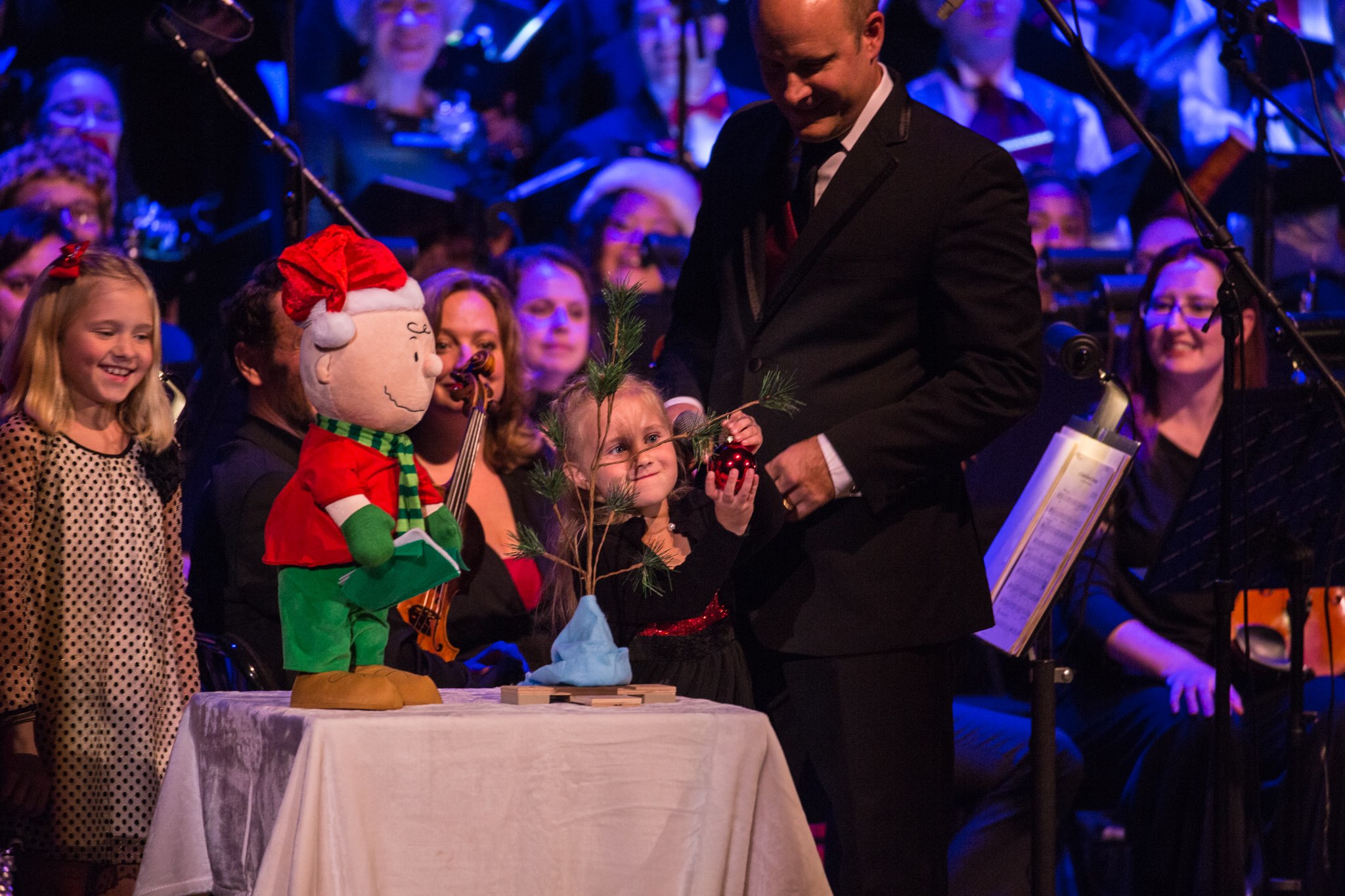 Maestro Fox with his daughters on stage