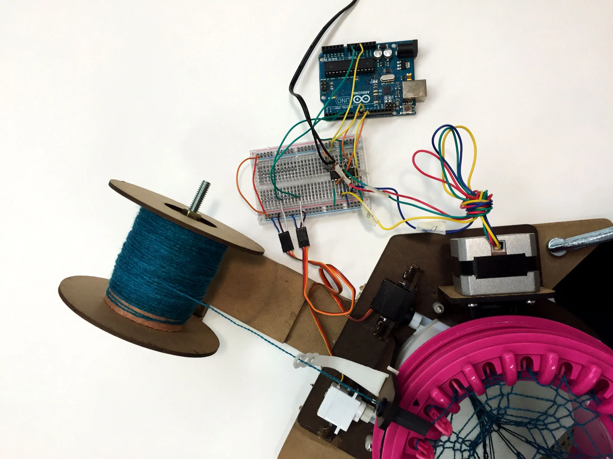 Machine updates: 12V stepper motor. Thread holder with tension adjustment.