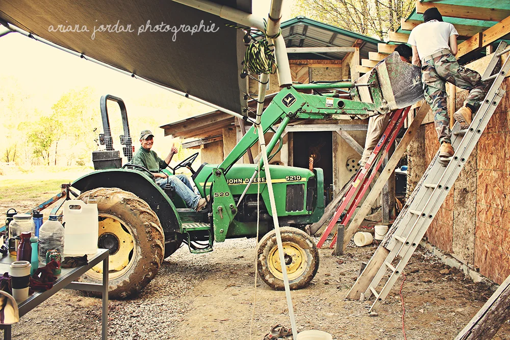 Diane's neighbor kindly lent his tractor to our cause--we used it to quickly mix and add a large batch of cob to the wall.