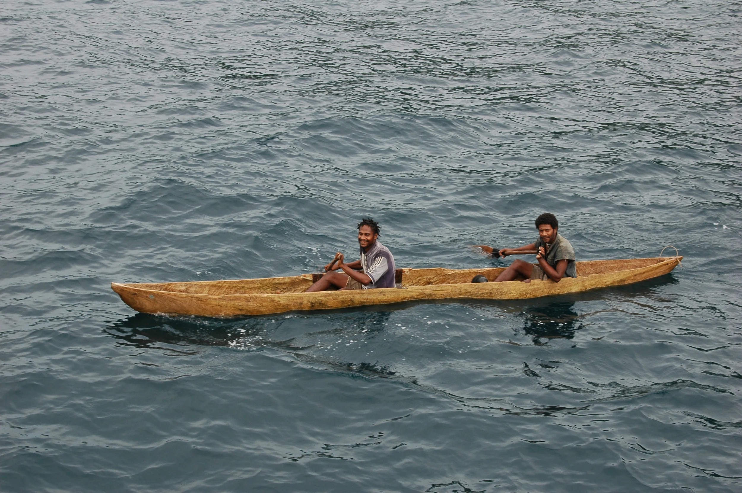 Locals in beautiful dugout canoe.