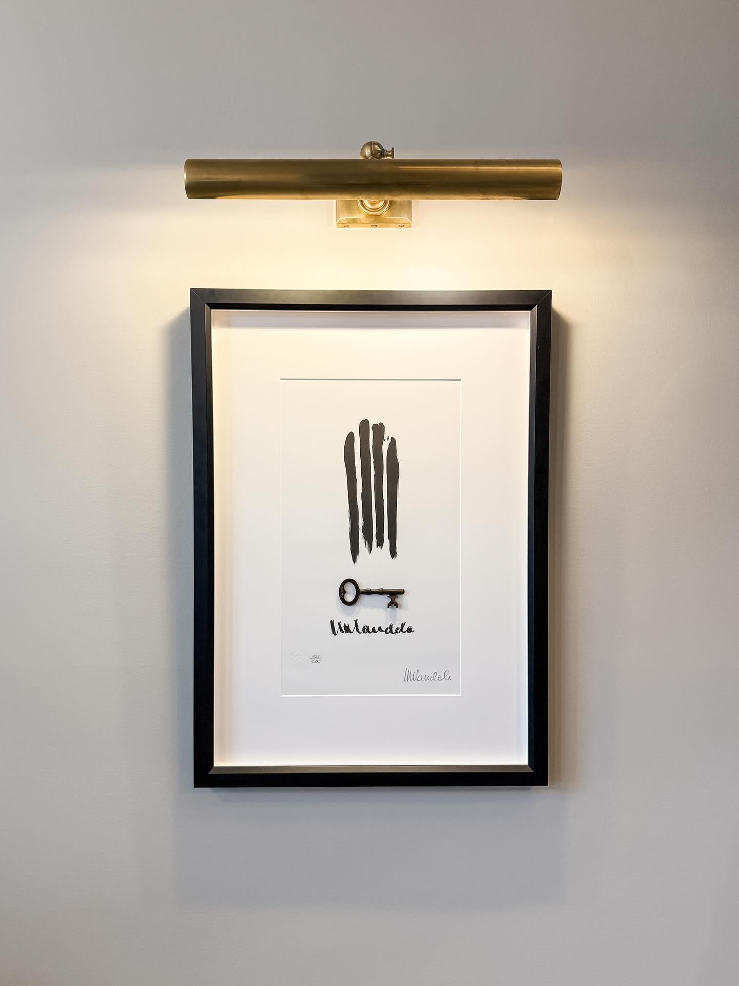 My beautiful @houseofmandelaart piece, created and signed by Madiba himself, finally has a deserving home. The finger-drawn re-creation of the bars of his prison cell with the replica of his actual cell&rsquo;s key made my breath catch in my throat t