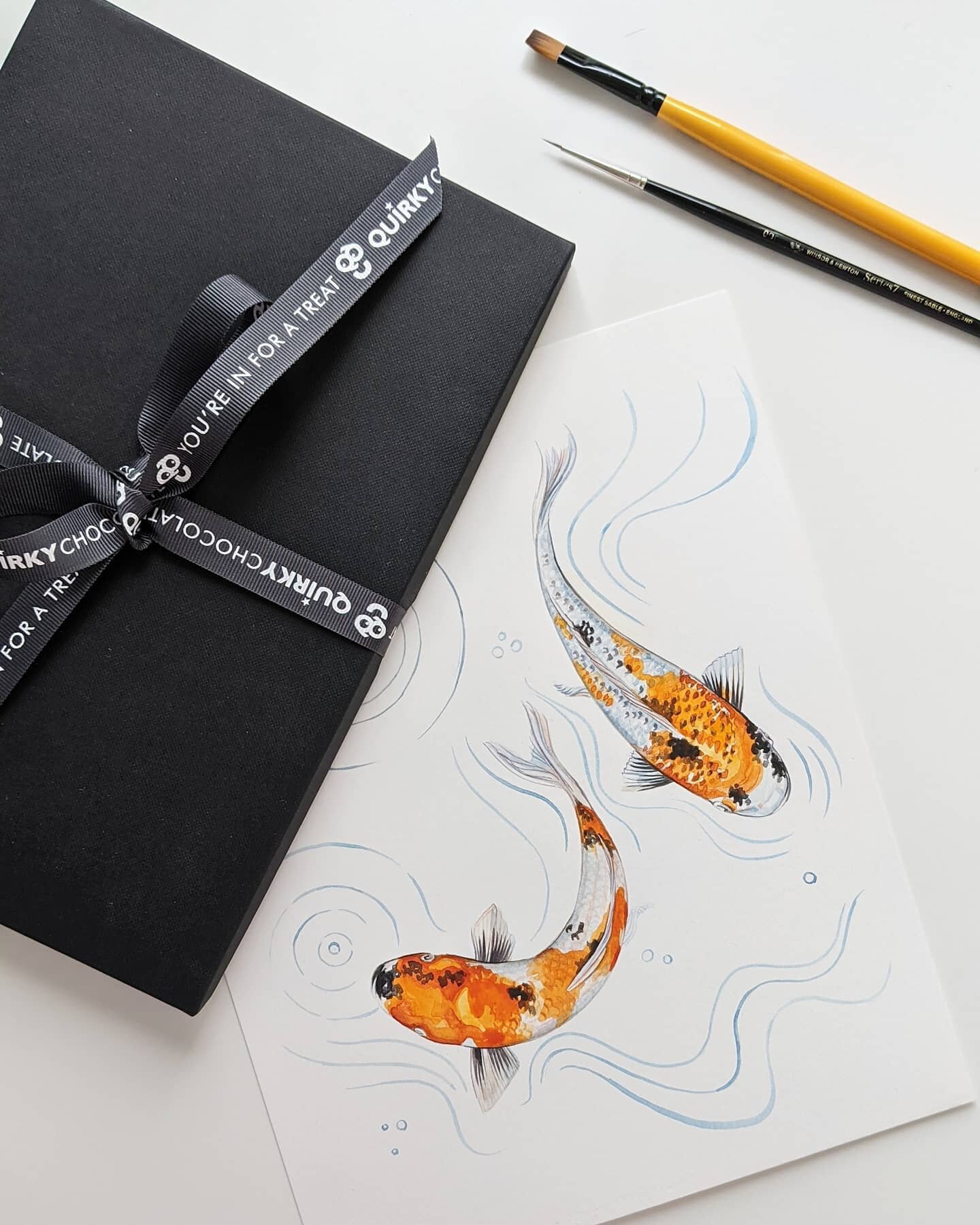 Giveaway time! 
To celebrate seeing my artwork on chocolate wrappers, I've decided to do my first ever giveaway. 

The prize is a special edition chocolate gift set from @quirkychocolate . Yum! 🍫
AND the original painting of koi carp from which the 