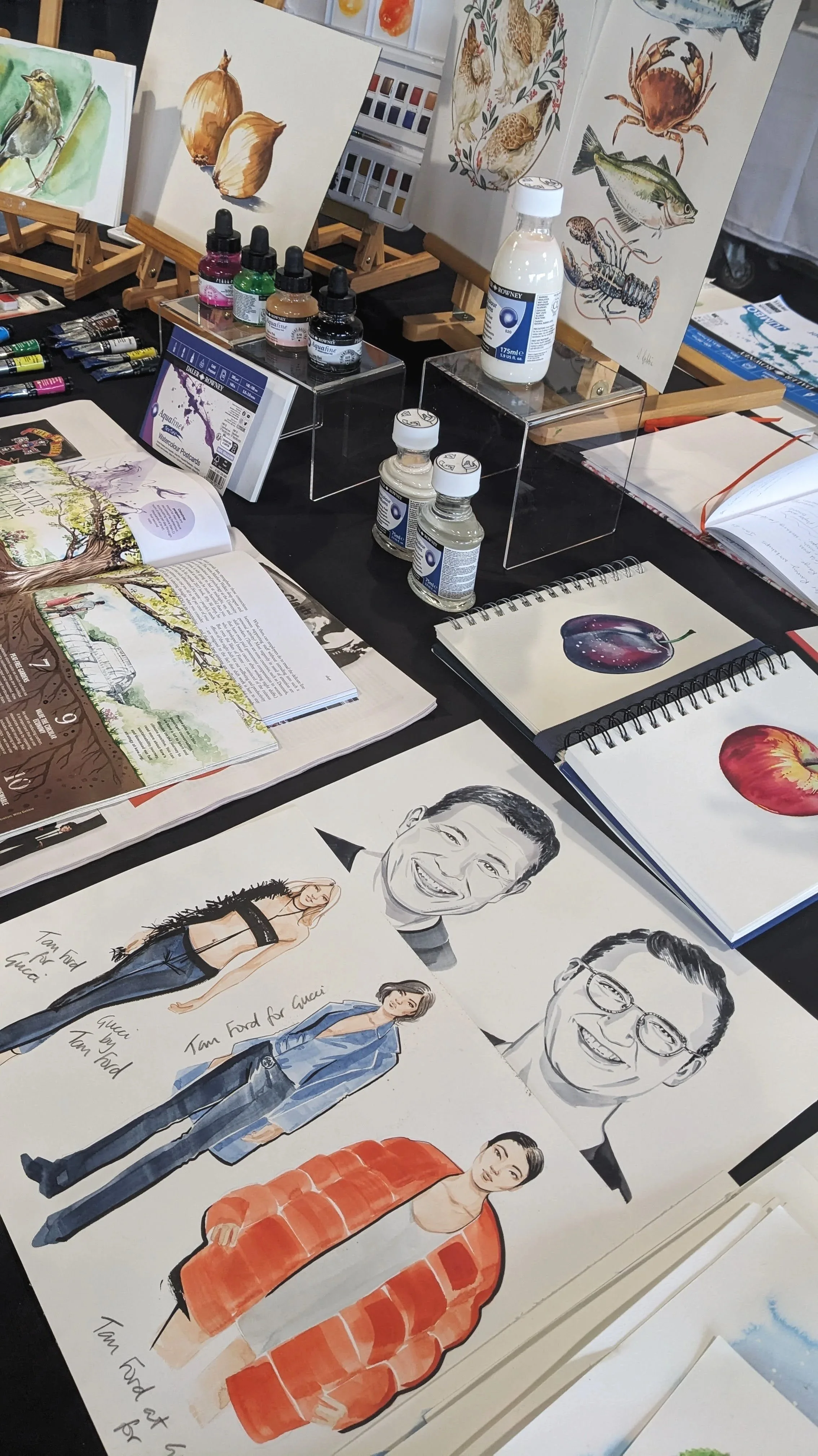 Artist demonstrating professional watercolour techniques using Aquafine paints