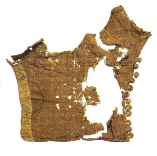 Buttons on a sleeve from excavations in London, 2nd quarter of the 14th century. Museum of London: Textiles and Clothing, Plate 1